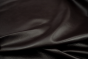 Close up of dark brown full grain upholstery leather