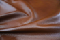 Close up picture of multitone cognac pigmented upholstery leather