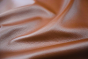 Close up picture of multitone cognac pigmented upholstery leather