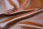 Close up picture of multitone cognac pigmented upholstery leather