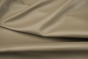 Close up of pearlized taupe top grain upholstery leather