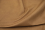 Close up of a light mocha color pull up upholstery leather 