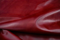 Close up of rich bright red full grain upholstery leather