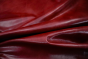 Close up of rich bright red full grain upholstery leather