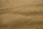 Close up picture of light tan hair on upholstery leather