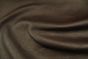 Close up of rich dark brown pigmented upholstery leather