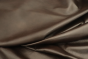 Close up picture of warm chocolate brown top grain upholstery leather