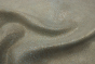 Close up of metallic gold with teal accents embossed suede-like upholstery leather