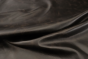Close up of espresso brown full grain distressed upholstery leather