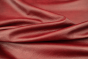 Closeup picture of Ella In Red soft, deep red colored upholstery leather for furniture