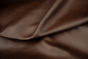 Closeup picture of Cuban Cigar chocolate brown top grain leather for sofas, chairs, and other furniture upholstery