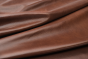 Closeup picture of Swing Time soft, dark brandy colored upholstery leather for furniture