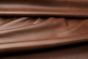 Closeup picture of Whiskey Beat soft, rich warm brown colored upholstery leather for furniture