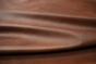 Picture of draping Whiskey Beat, rich warm brown genuine cowhide leather for upholstery