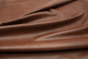 Closeup picture of Whiskey Beat, rich warm brown top grain leather for sofas, chairs, and other furniture upholstery