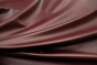 Closeup picture of Wine Bar, dark burgundy top grain leather for sofas, chairs, and other furniture upholstery