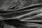 Close up of rich black distress natural grain upholstery leather