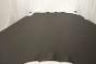 Picture of warm multitone grey Italian upholstery leather displayed on a table