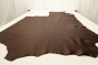 Picture of a tobacco brown semi-aniline leather displayed on a table