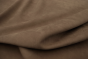 Picture draping taupe colored nubuck fabric for use in apparel