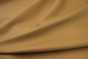 Close up picture of warm golden barley nappa like leather for upholstery 