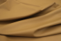 Close up picture of warm golden barley nappa like leather for upholstery 