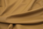 Close up picture of warm golden barley nappa like leather for upholstery 