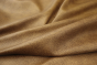 Close up of tan with dark brown highlights pebble grain leather for upholstery