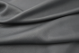 Close up picture of a dark grey with a hint of blue full grain leather for upholstery