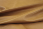 Close up picture of warm gold full grain upholstery leather