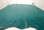 Picture of aquamarine aniline leather for upholstery displayed on a table