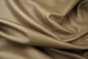 Close up picture of warm mushroom full grain upholstery leather