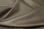 Close up of multi tone medium grey full grain leather for upholstery