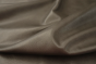 Close up of multi tone medium grey full grain leather for upholstery