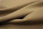 Close up of warm dark sand color Italian upholstery leather