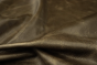 Close up picture of dark brown pull up upholstery leather
