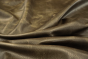 Close up picture of dark brown pull up upholstery leather
