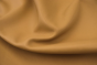Close up of soft golden camel nappa like upholstery leathe
