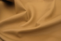 Close up of soft golden camel nappa like upholstery leathe