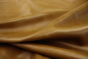 Close up picture of golden amaretto pull up upholstery leather