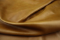 Close up picture of golden amaretto pull up upholstery leather