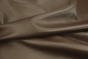 Close up of rich dark brown full grain upholstery leather