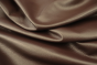 Close up picture of rich plum pigmented leather for upholstery