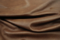 Close up picture of multitone medium brown semi aniline upholstery leather