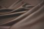 Close up picture of dark brown pigmented leather for upholstery 
