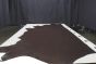 Espresso brown colored Italian leather cowhide laying flat on a table 