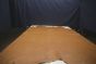 Golden brown colored vintage leather cowhide laying flat on a table 