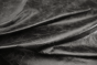 Close up of rich black distress natural grain upholstery leather