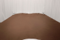 Picture of Preservation Brown, medium brown semi-aniline leather hide for upholstery displayed on a table