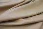 Khaki colored leather material laying flat on a table 